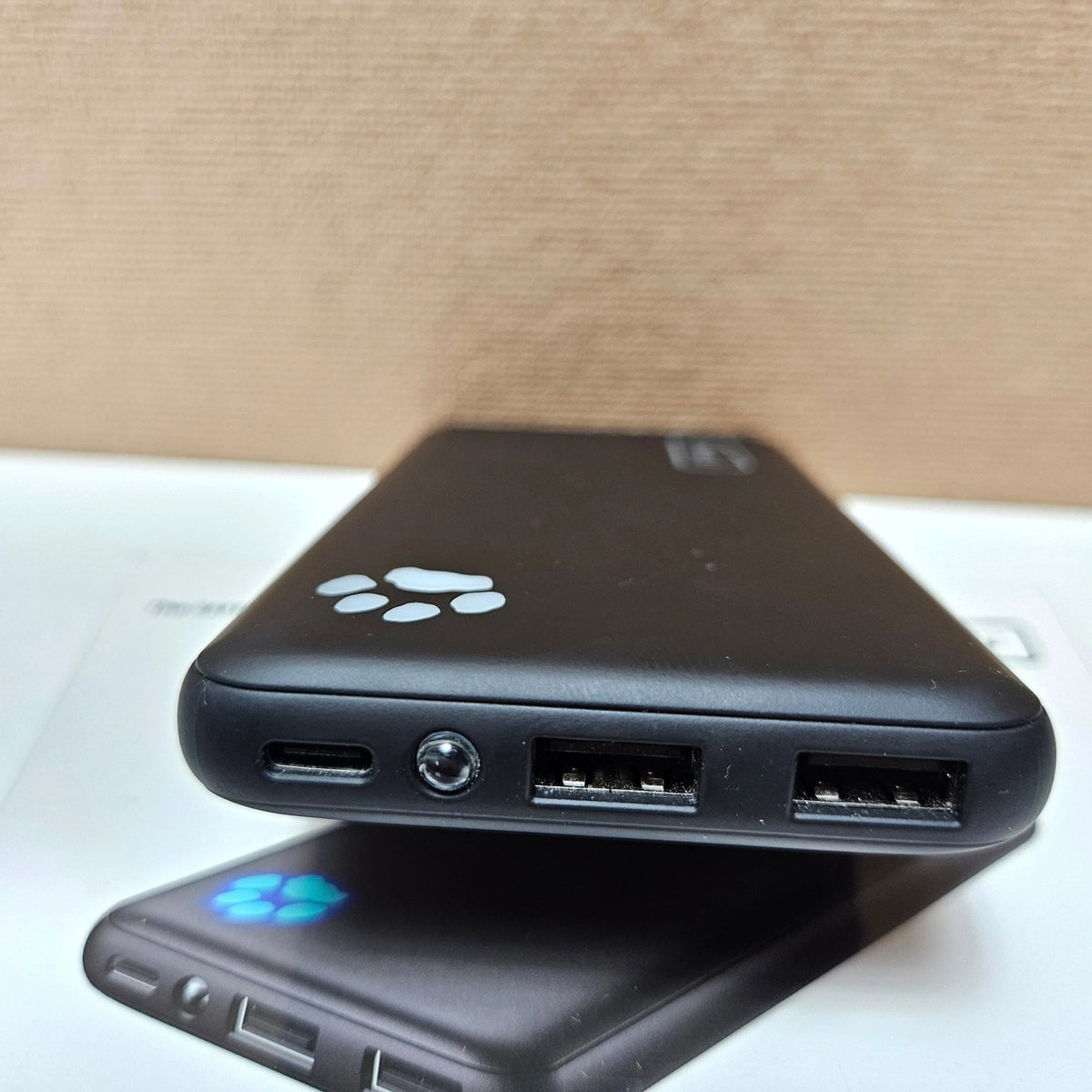 Close-up of INIU power bank USB-C and USB-A charging ports.
