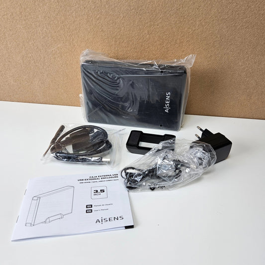 Unboxed AISENS 3.5-inch hard drive enclosure kit with cables, power adapter, and manual