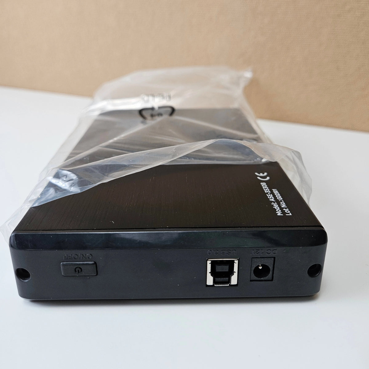 Rear ports of AISENS ASE-3530B enclosure showing USB 3.0, DC 12V input, and power switch