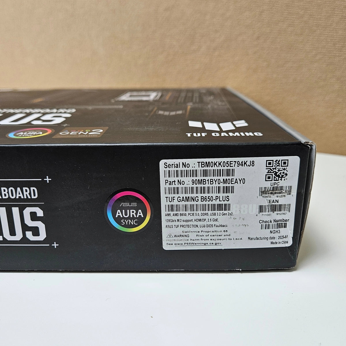 Close-up of the serial number and product details sticker on the motherboard box