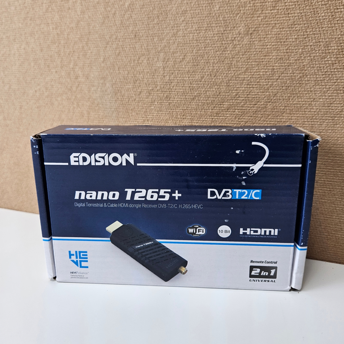 A boxed EDISION nano T265+ DVI-T2-C digital television.
