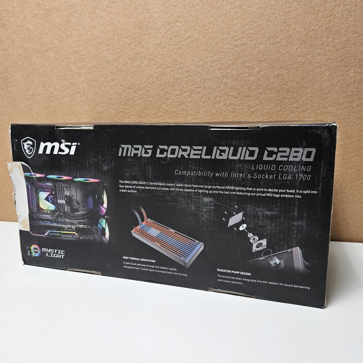 MSI MAG Coreliquid C280 Liquid Cooling retail packaging box, displayed on a white surface against a brown cardboard background.