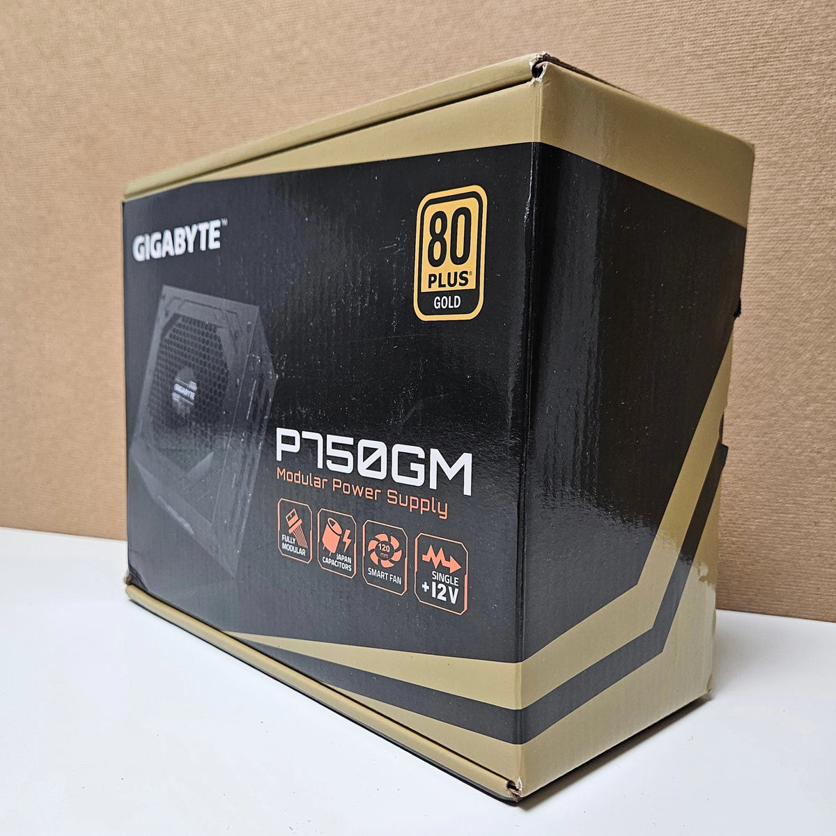 Back of Gigabyte P750GM power supply retail box showing complete specs and cable configurations