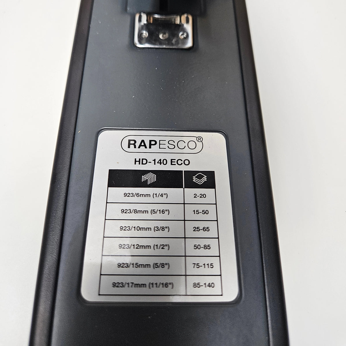 Staple size compatibility and sheet capacity guide chart on the stapler base