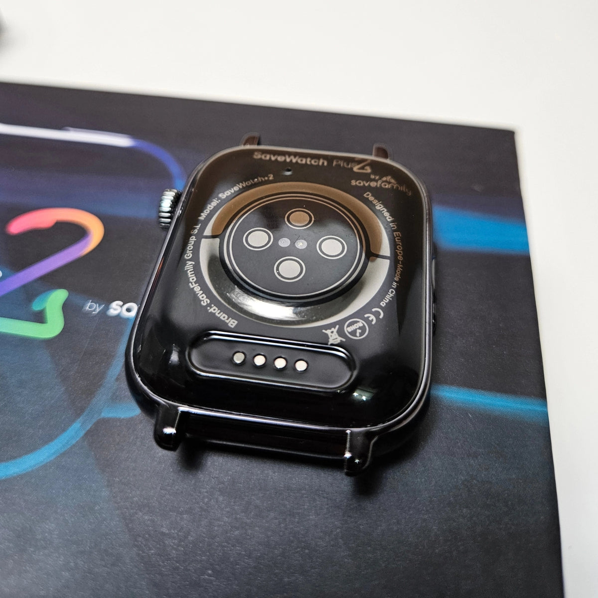 Close-up of the back casing of SaveWatch Plus 2 showing health tracking sensors