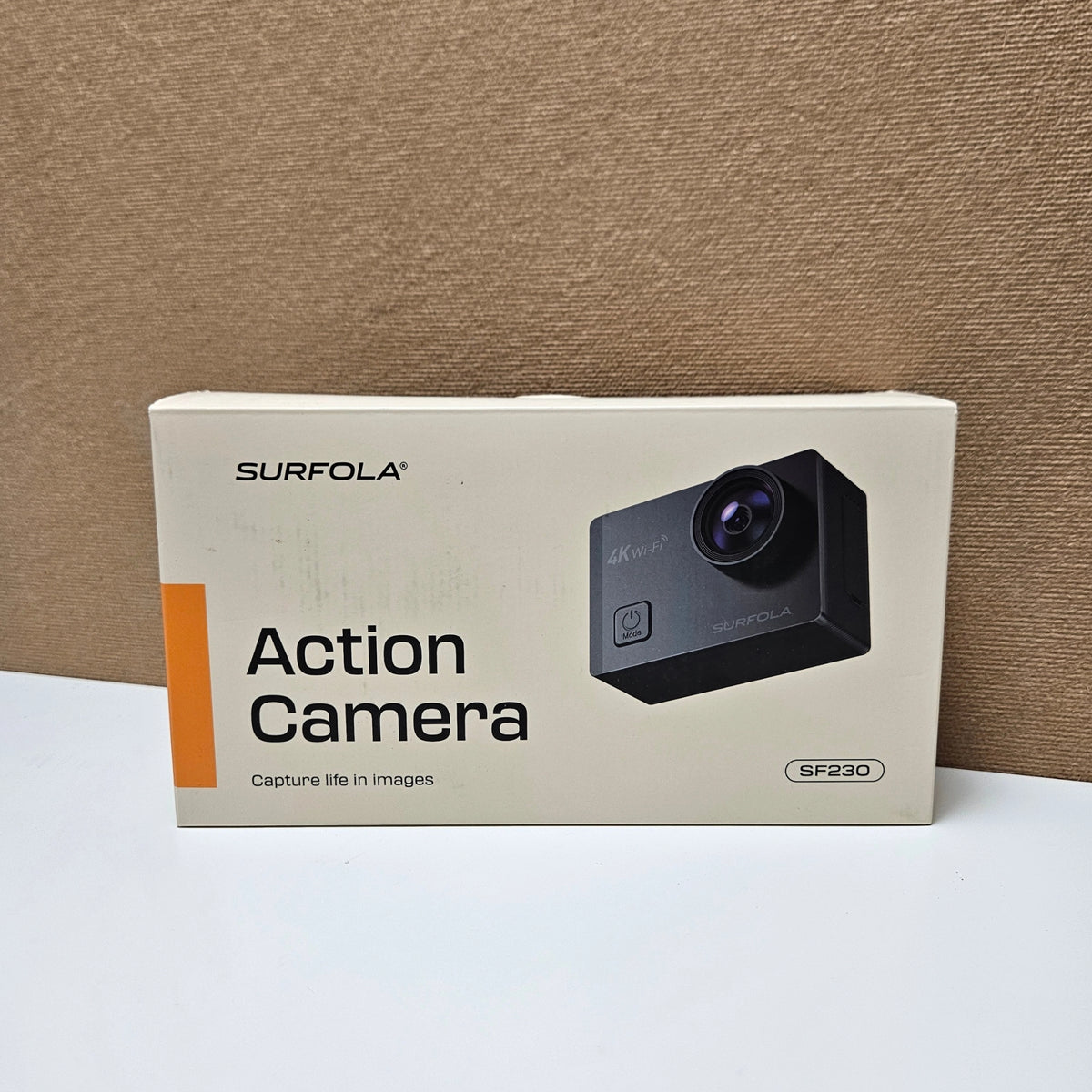 Front view of the original white retail packaging box for Surfola SF230 action camera.