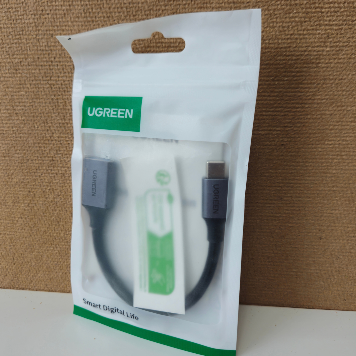 UGREEN USB-C cable in its original white and green retail packaging.